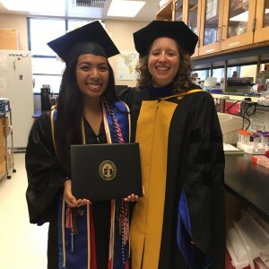 student and PI in graduation garb